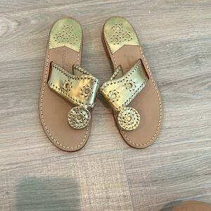 Jack Rogers gold sandals.